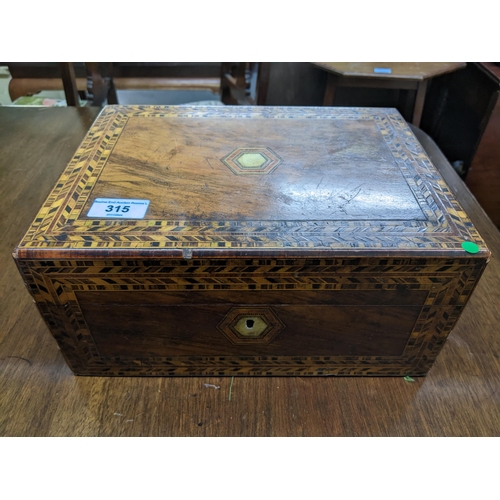 315 - A 19th century rosewood work box with inlaid German style strapwork edge, hexagonal inlaid mother of... 