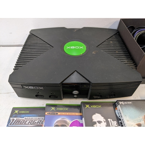 339 - An Xbox One, with a controller, converter and a selection of games to include Need for Speed Undergr... 