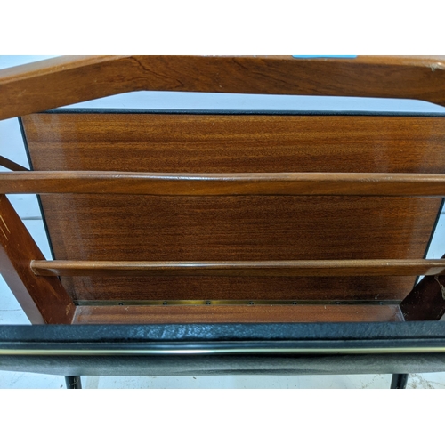 342 - A mid 20th century teak folding magazine rack Location: A3M
If there is no condition report shown, p... 