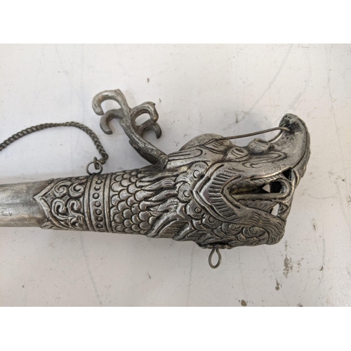 344 - A silver plated Nepalese trumpet Location: LAM
If there is no condition report shown, please request