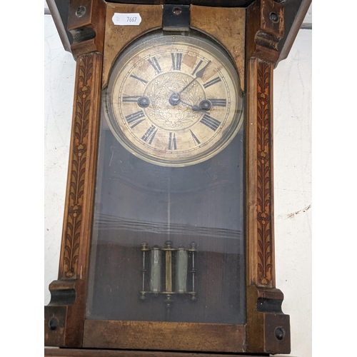 350 - An American mahogany veneered cased mantel timepiece by Waterbury Clock Company faced by a decorated... 