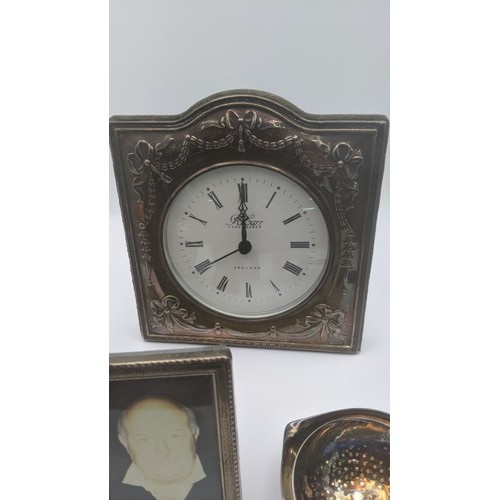 171 - Mixed silver items to include a tea caddy pot 91.9g, silver fronted desk clock, photo frame and a si... 