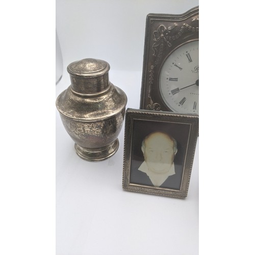 171 - Mixed silver items to include a tea caddy pot 91.9g, silver fronted desk clock, photo frame and a si... 