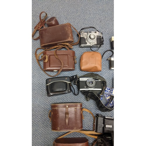 378 - A mixed lot of binoculars and photographic equipment and accessories to include an Instaload 126, tw... 