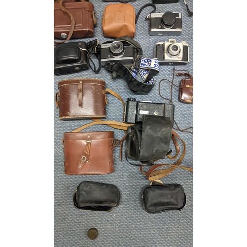 378 - A mixed lot of binoculars and photographic equipment and accessories to include an Instaload 126, tw... 