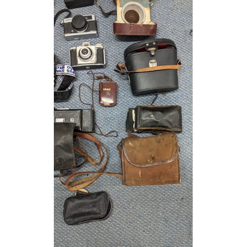 378 - A mixed lot of binoculars and photographic equipment and accessories to include an Instaload 126, tw... 