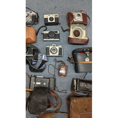 378 - A mixed lot of binoculars and photographic equipment and accessories to include an Instaload 126, tw... 