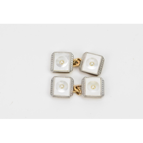 242 - A 9ct yellow and white gold dress shirt set, each having a seed pearl centre, mother of pearl and ma... 