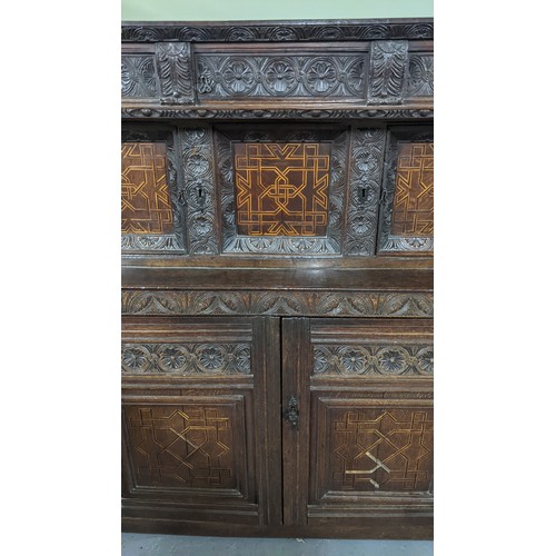 247 - A late 17th/early 18th century oak carved didarn / court cupboard, carved with repeating motifs, two... 