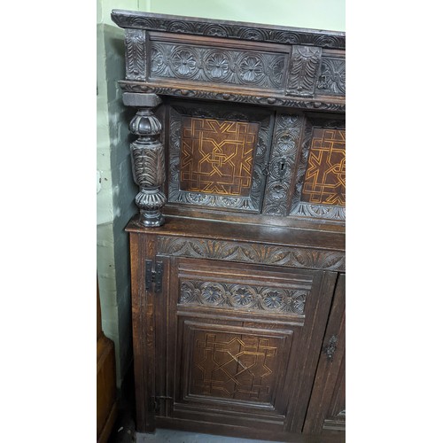 247 - A late 17th/early 18th century oak carved didarn / court cupboard, carved with repeating motifs, two... 