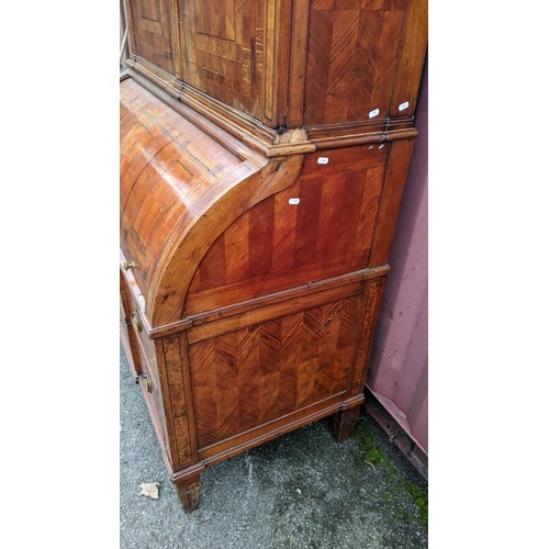 244 - A late 18th century German secretaire cylinder desk, inlaid with mixed veneers, chequer banded, dent... 