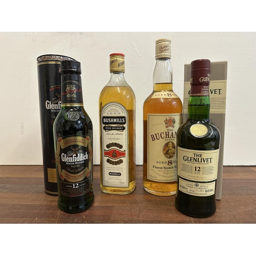 76 - Four bottles of Whisky to include The Buchanan blend, 70cl, Bushmills 700ml, Glenfiddich 12 year, 35... 