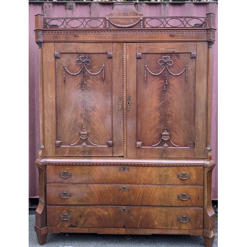 246 - An 18th century Dutch mahogany linen press, the cornice having repeated interlocking semi circle des... 