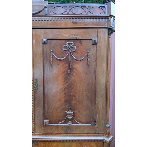 246 - An 18th century Dutch mahogany linen press, the cornice having repeated interlocking semi circle des... 