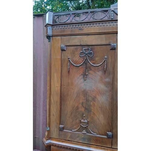 246 - An 18th century Dutch mahogany linen press, the cornice having repeated interlocking semi circle des... 