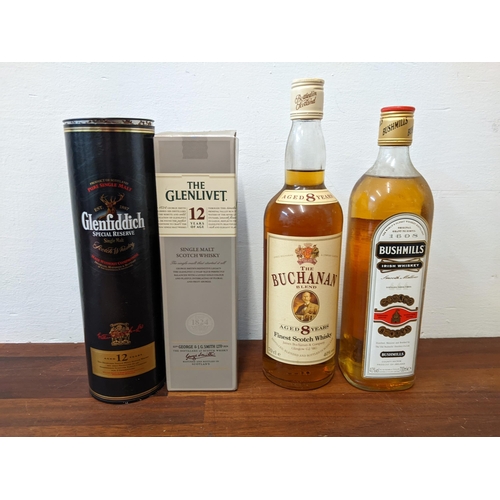 76 - Four bottles of Whisky to include The Buchanan blend, 70cl, Bushmills 700ml, Glenfiddich 12 year, 35... 