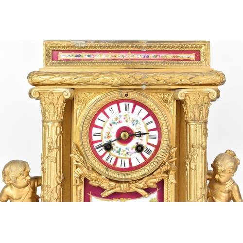 111 - A late 19th century French gilt metal mantle clock, the case of architectural form, mounted with che... 