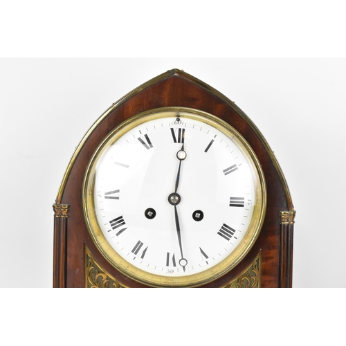 112 - An Edwardian mahogany mantle clock, Regency inspired with pierced gilt metal grilles, twin lion ring... 