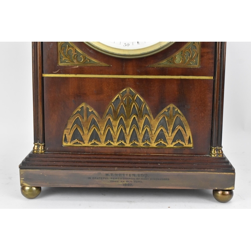 112 - An Edwardian mahogany mantle clock, Regency inspired with pierced gilt metal grilles, twin lion ring... 