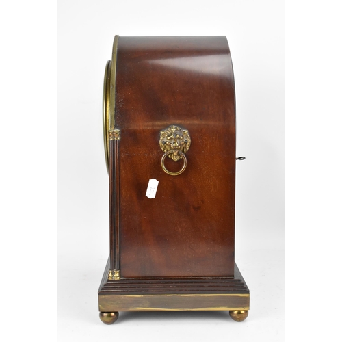 112 - An Edwardian mahogany mantle clock, Regency inspired with pierced gilt metal grilles, twin lion ring... 