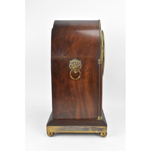 112 - An Edwardian mahogany mantle clock, Regency inspired with pierced gilt metal grilles, twin lion ring... 