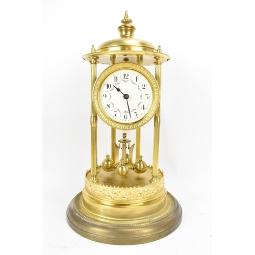 114 - A circa 1900 gilt metal anniversary clock with glass dome, the 3.5