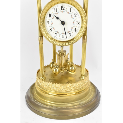 114 - A circa 1900 gilt metal anniversary clock with glass dome, the 3.5