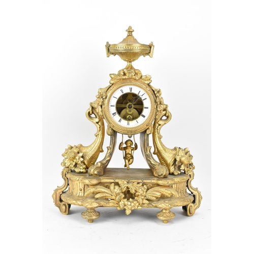 116 - A late 19th century French gilt metal mantle clock, the case decorated with an urn finial, flowers a... 