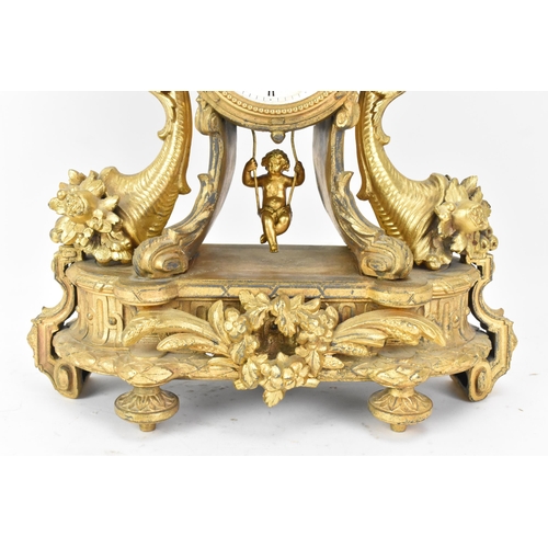 116 - A late 19th century French gilt metal mantle clock, the case decorated with an urn finial, flowers a... 