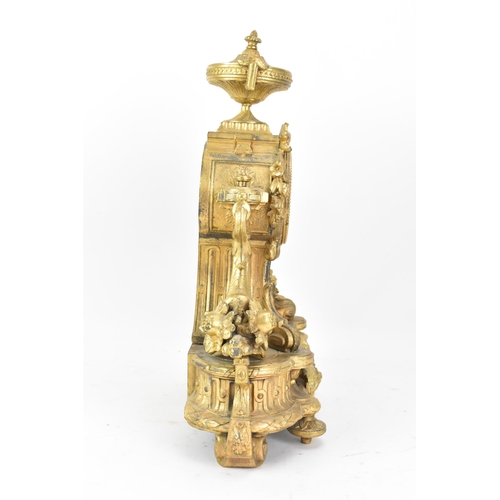 116 - A late 19th century French gilt metal mantle clock, the case decorated with an urn finial, flowers a... 