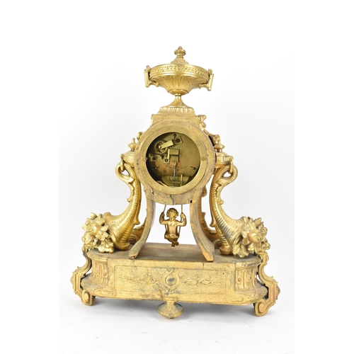 116 - A late 19th century French gilt metal mantle clock, the case decorated with an urn finial, flowers a... 