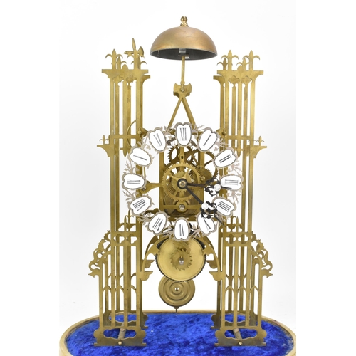 117 - A 19th century brass skeleton clock, having Roman numerals and white enamel plaques, 8 day chain fus... 