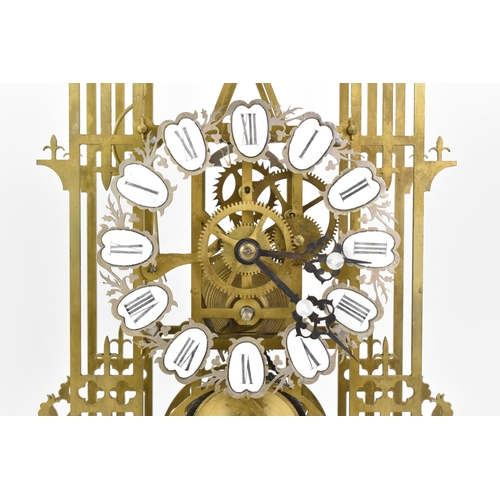 117 - A 19th century brass skeleton clock, having Roman numerals and white enamel plaques, 8 day chain fus... 