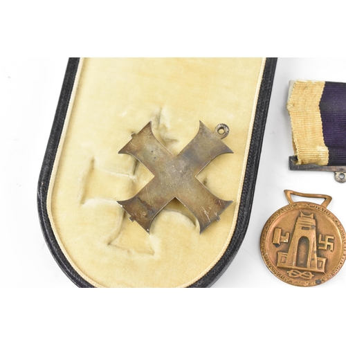 131 - A WWI and WWII medal group to include a cased military cross, 1914/15 star, War and Victory medal na... 