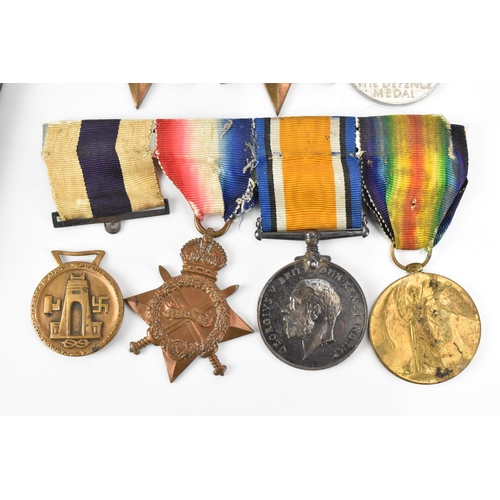 131 - A WWI and WWII medal group to include a cased military cross, 1914/15 star, War and Victory medal na... 