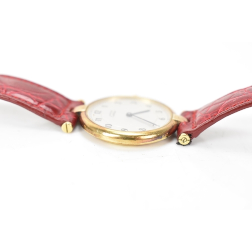 5 - A Cartier 'Must de' Vendome, quartz, ladies, silver gilt wristwatch, having a silvered dial with Ara... 