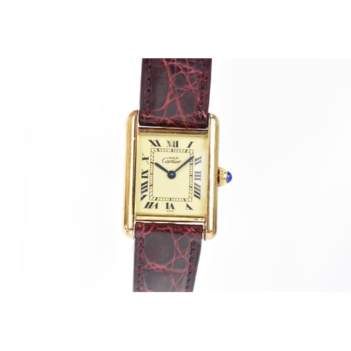 6 - A Cartier 'Must de' Tank, quartz, ladies, silver gilt wristwatch, the dial having Roman numerals, bl... 