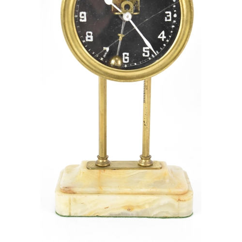 88 - An early 20th century brass gravity clock, possibly by Watson & Webb Kee-less Clock Company, the bra... 