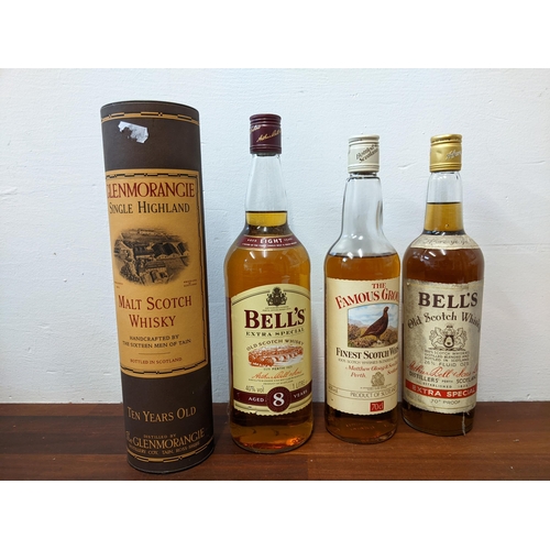 128 - Five bottles of whisky to include Famous Grouse and Bells, 70cl, Bells 1ltr and Glenmorangie 70cl
Lo... 