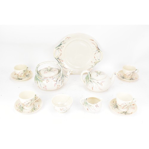 249 - A 19th century Belleek 1st period tea set, consisting of two tea pots, twin handled plate, four cups... 