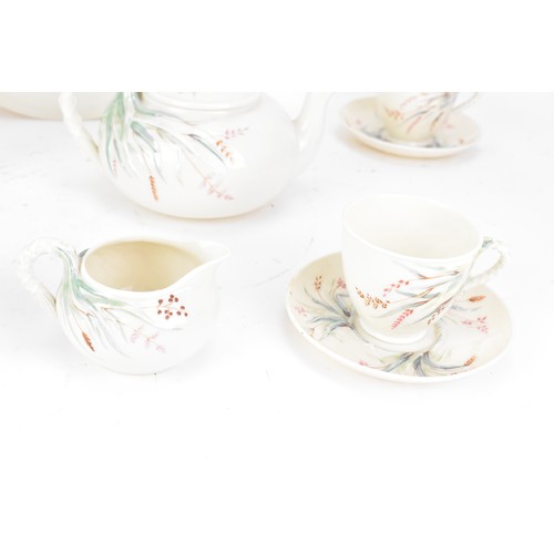 249 - A 19th century Belleek 1st period tea set, consisting of two tea pots, twin handled plate, four cups... 