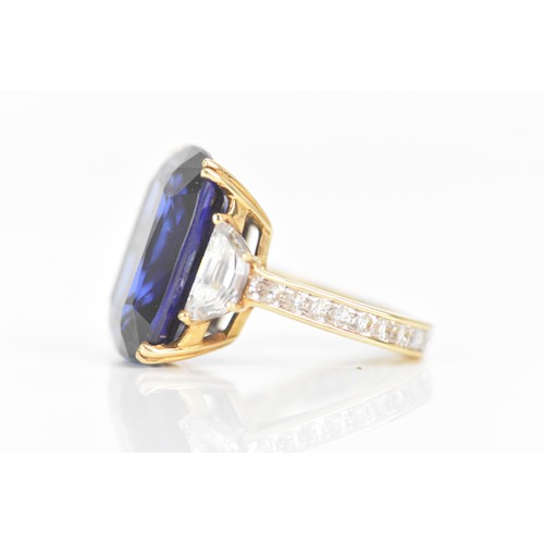 254 - A yellow gold dress ring, set with a large faceted cut blue coloured stone in a four claw setting, f... 