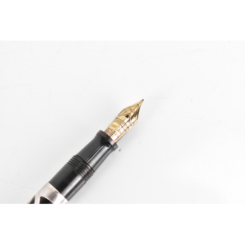 255 - A Sheaffer sterling silver fountain pen, black resin barrel and cap with foliate sterling silver mou... 