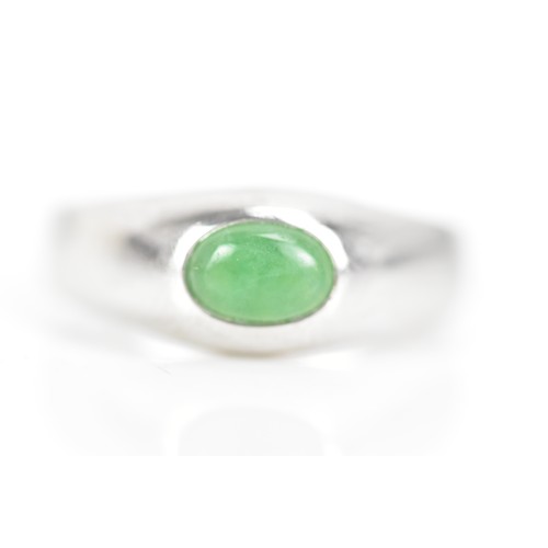 253 - An 18ct white gold jade ring, with a certificate of guarantee stating the jade 1.08cts, stamped 750,... 