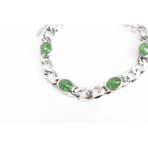 251 - An 18ct white gold jade set bracelet, having curb chain links with five jade cabochons, certificate ... 