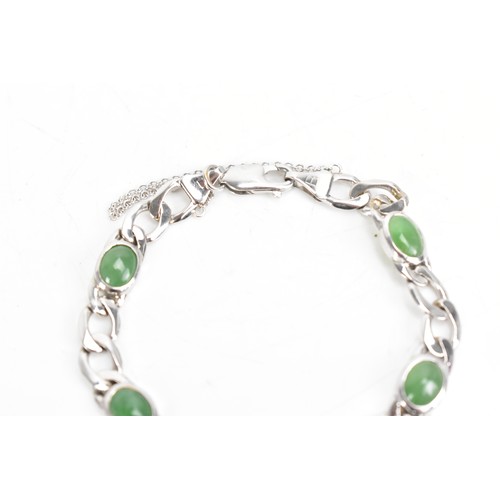 251 - An 18ct white gold jade set bracelet, having curb chain links with five jade cabochons, certificate ... 