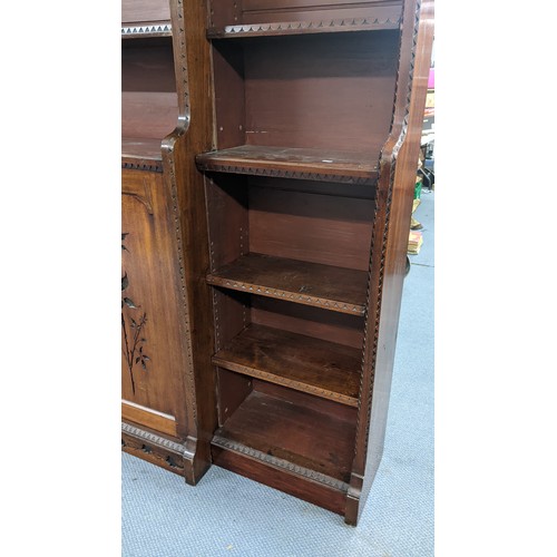 250 - A late Victorian Aesthetic mahogany open breakfront bookcase, having a moulded cornice, loose shelve... 