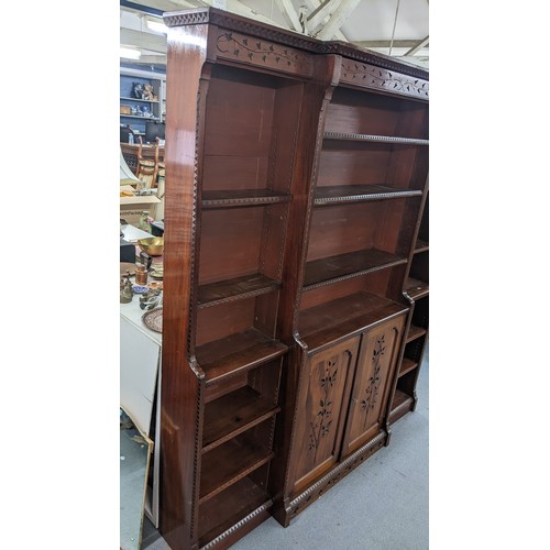 250 - A late Victorian Aesthetic mahogany open breakfront bookcase, having a moulded cornice, loose shelve... 