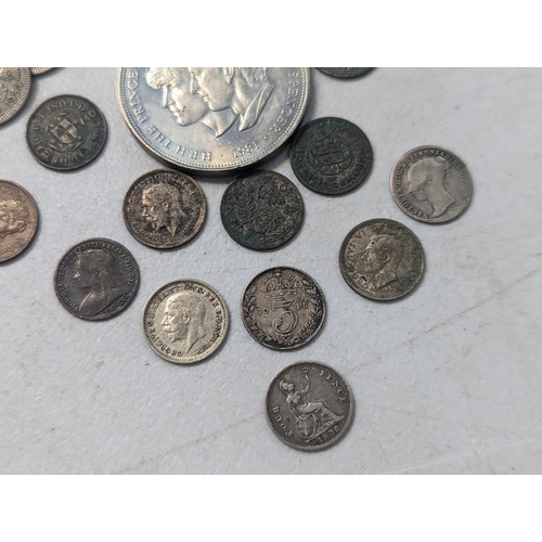 28 - A mixed collection of British coins to include an 1836 William IV fourpence, along with mixed Victor... 