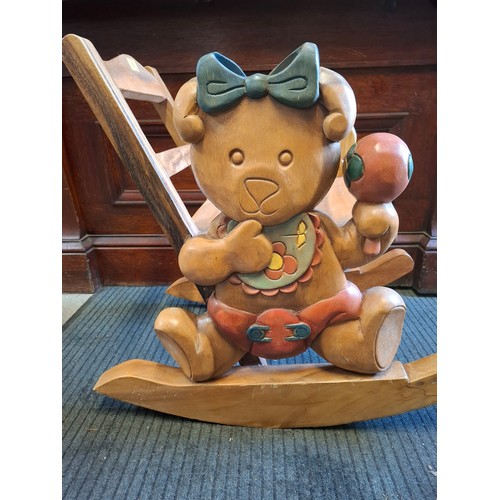 55 - A modern teak child's rocking chair with baby teddy bear design to the sides. Location:G